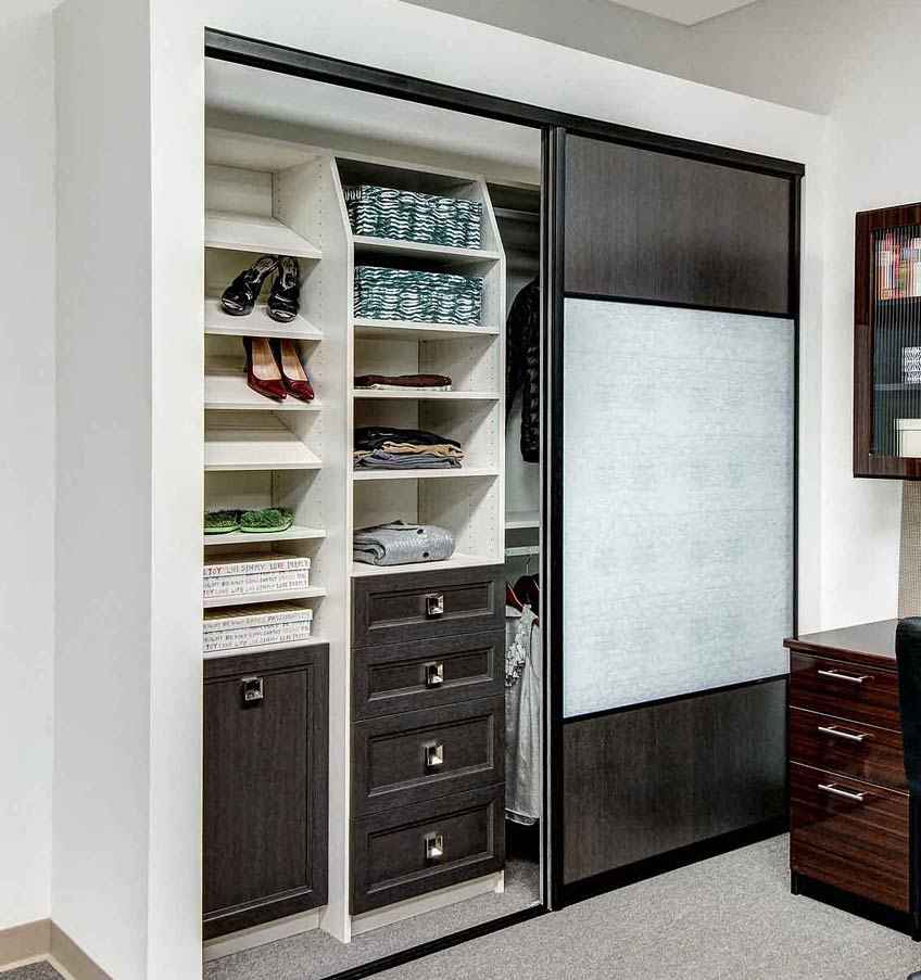 dark gray and white closet with sliding door