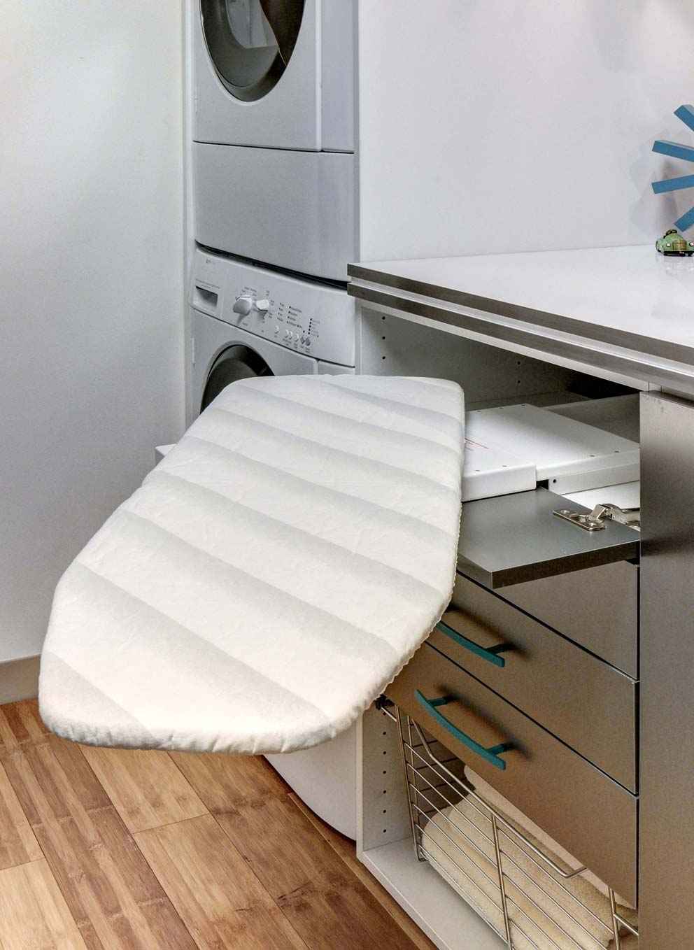 laundry closet with a ironing board